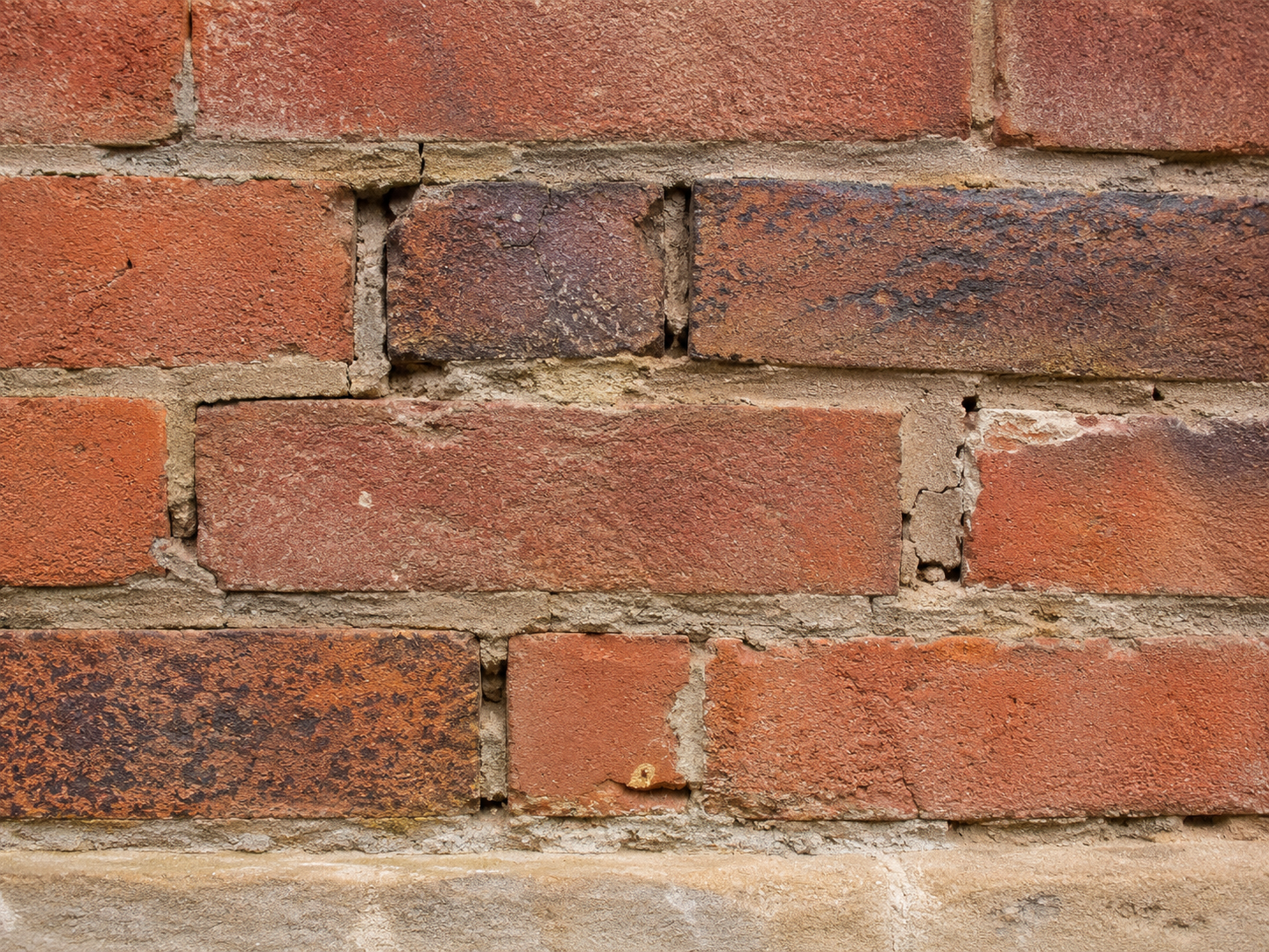 close-up of weathered brick and deteriorated mortar joints for masonry restoration